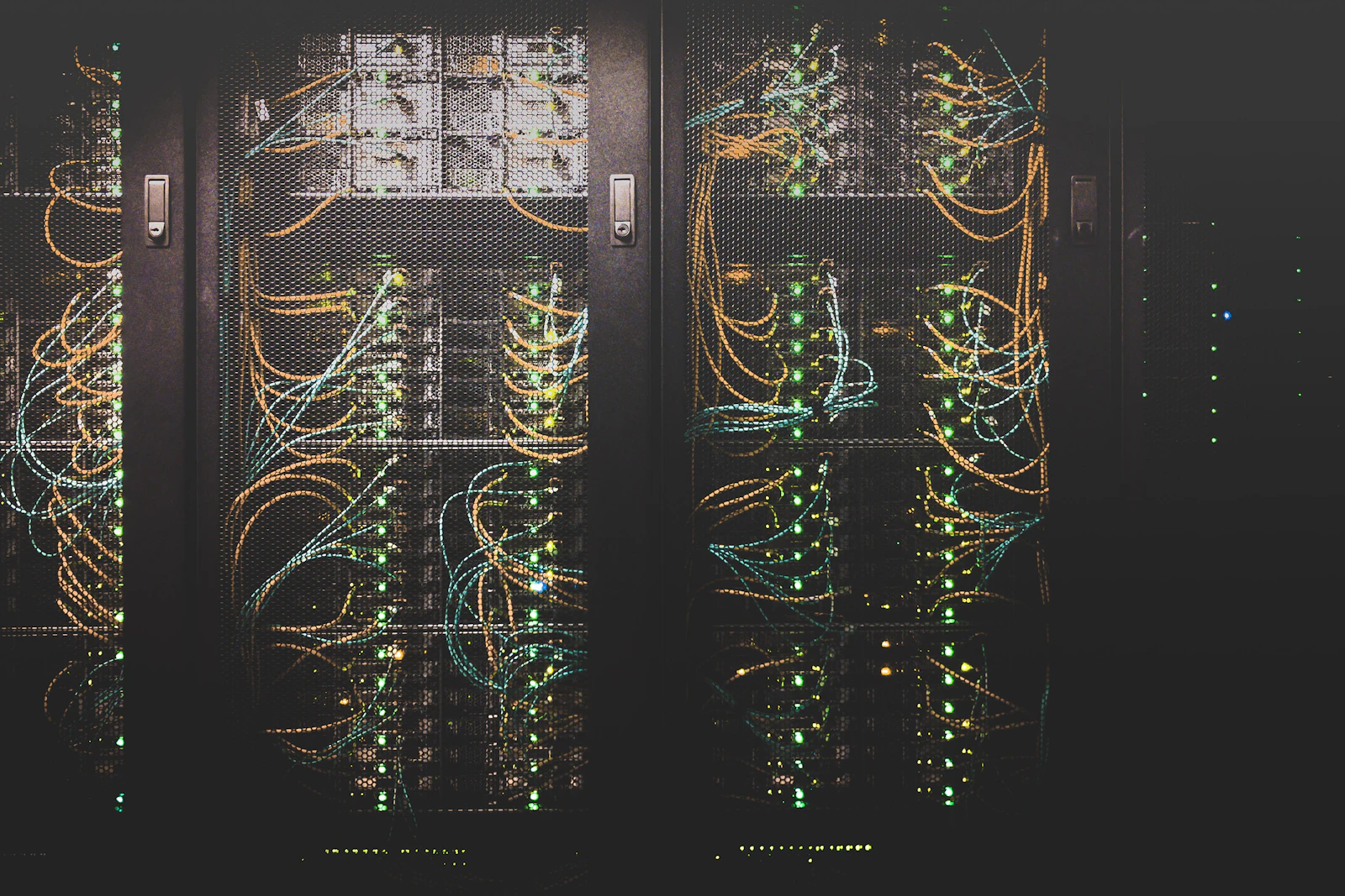Data-centre server racks threaded with bundled network cables