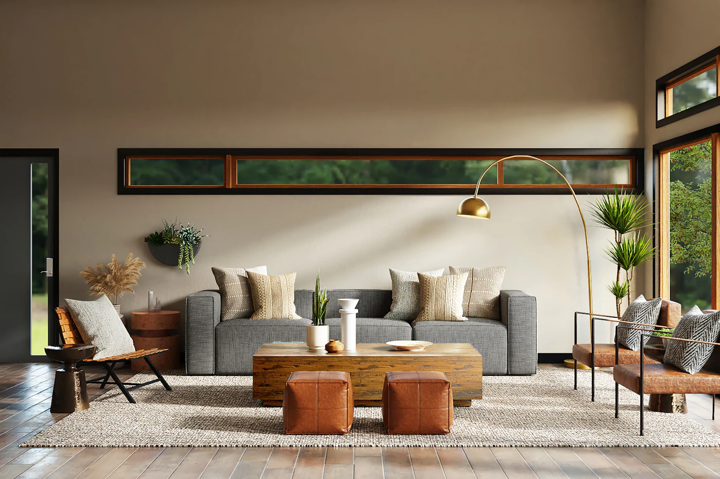 A bright living room with a grey sofa, low wooden coffee table and leather ottomans