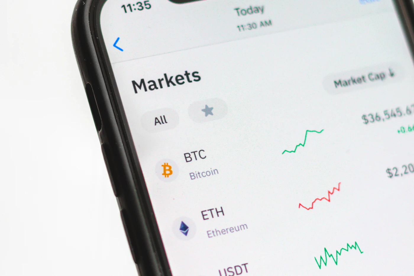 A smartphone screen showing a cryptocurrency market price list